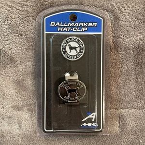 Golf tees and a ball marker with a hat clip